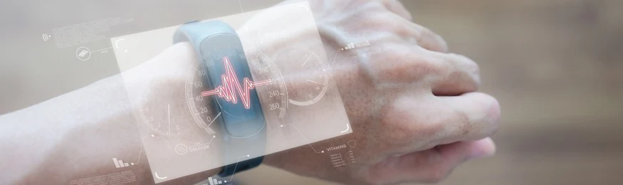 A wrist wearable showing a pulse trace under a translucent heart-rate overlay
