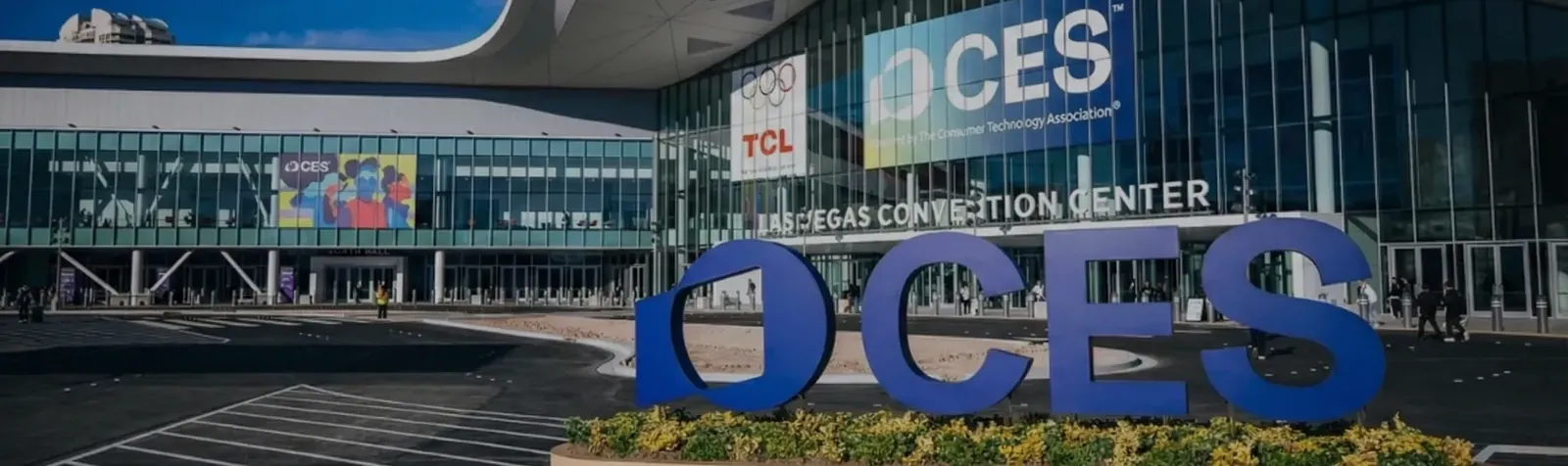 The CES sign outside the Las Vegas Convention Center, with CES banners on the glass facade