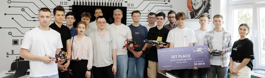 Group photo of IoT Challenge 2025: Drone Tech participants with drones, controllers and the 1st Place board in IoT Space