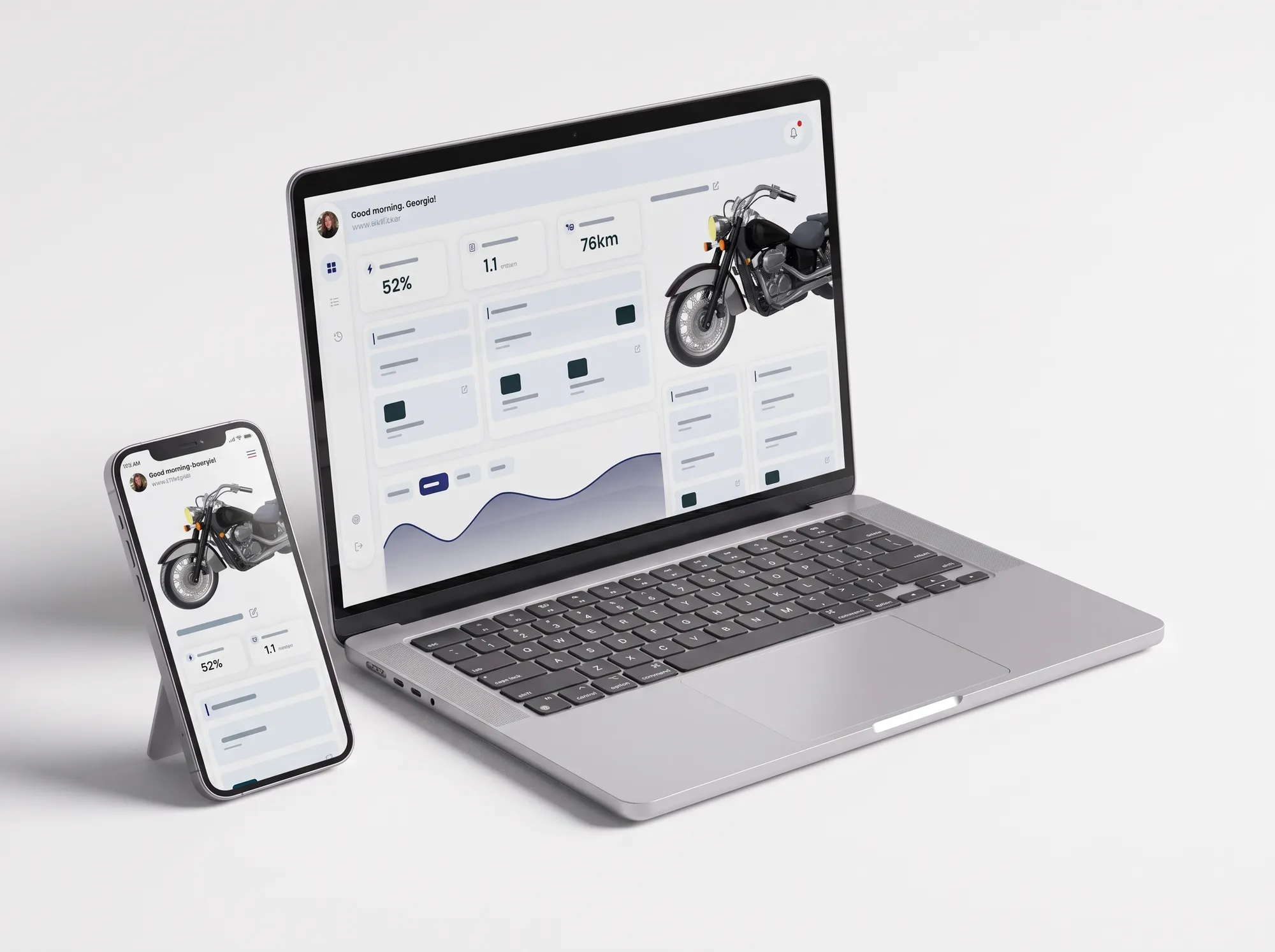 A laptop and a phone showing a motorcycle companion app with ride and battery figures