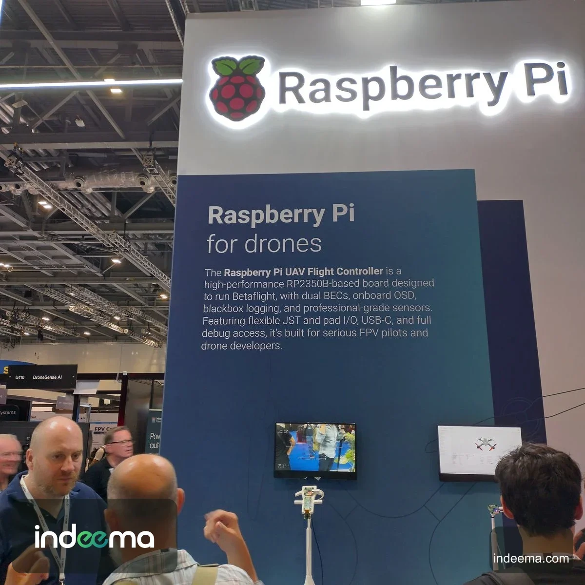 Raspberry Pi stand describing its RP2350B-based UAV Flight Controller for Betaflight