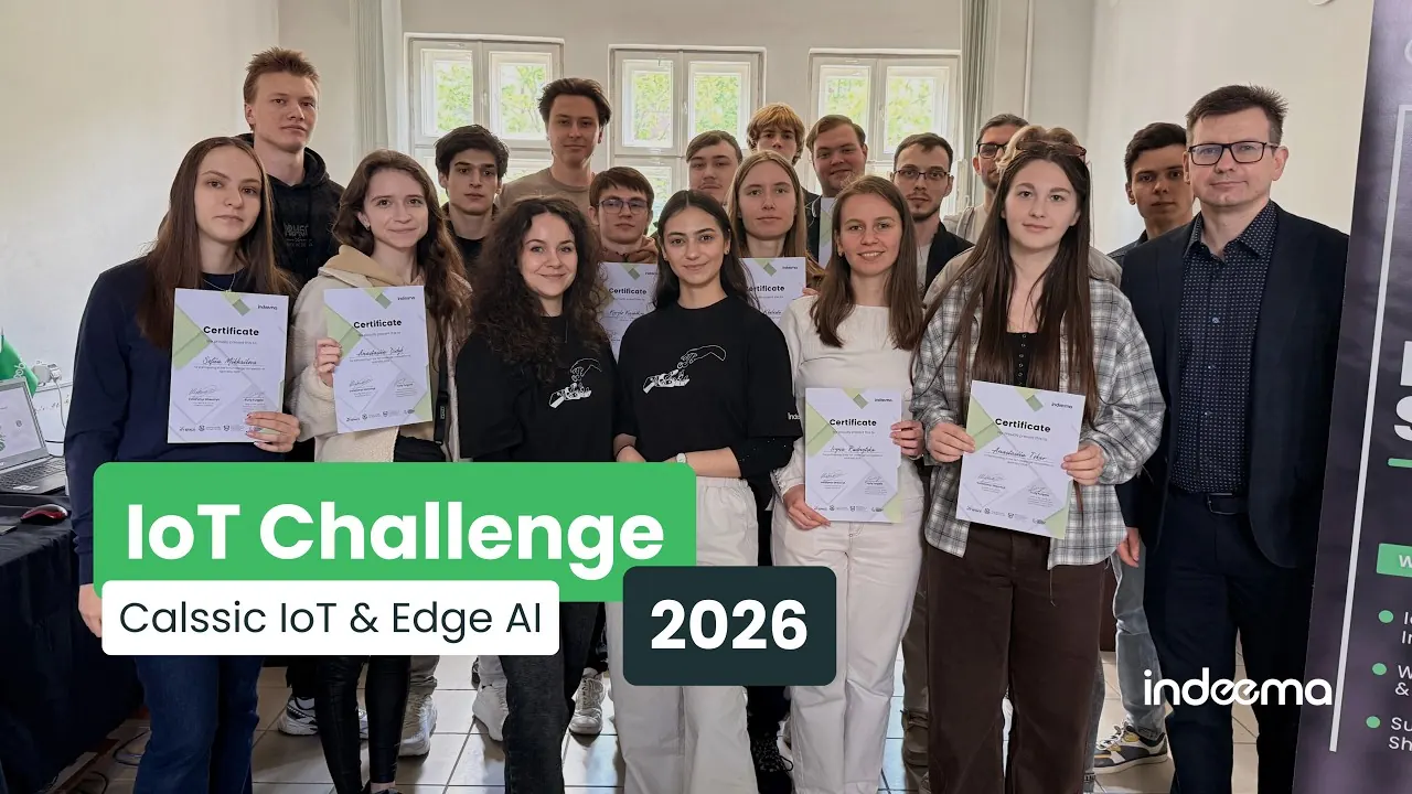 Video still: student participants holding certificates in a group photograph, captioned IoT Challenge 2026
